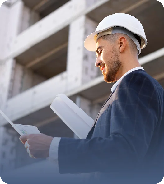 Professional JVRC consultant in gray shirt smiling confidently, ready for personalized insurance consultations