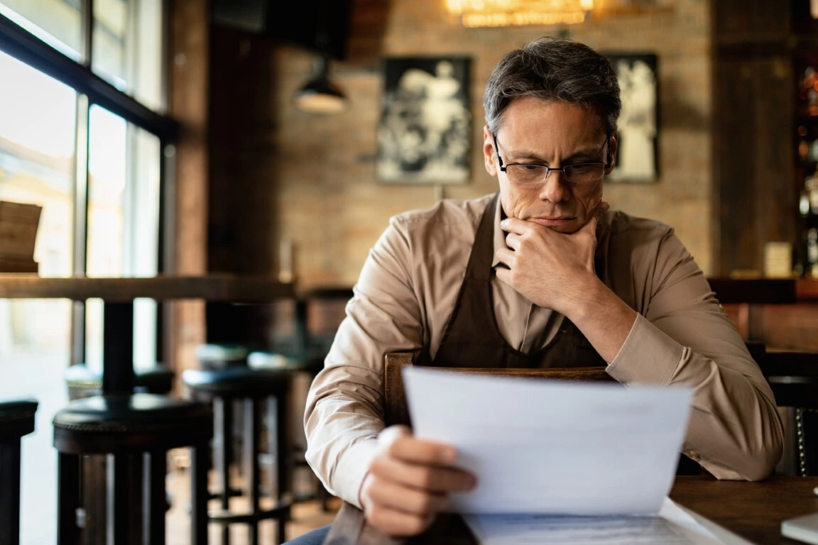 A business owner reviews his insurance liability limits.